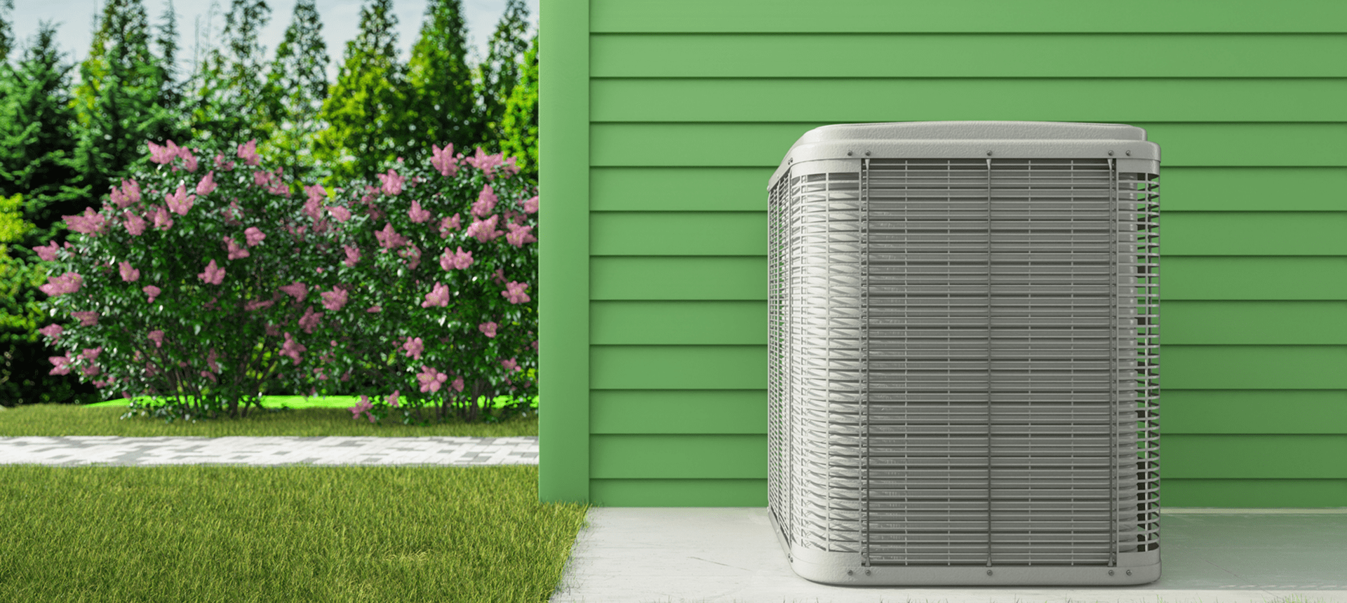 Outdoor AC unit near flowering bushes